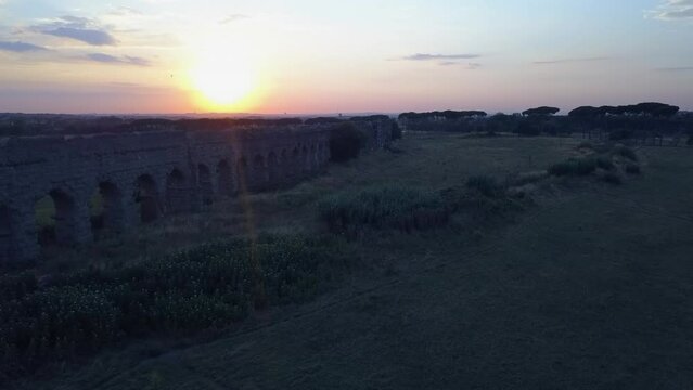 Sunset aerial flight to Aqua Anio Vetus ancient aqueduct ruin in Rome