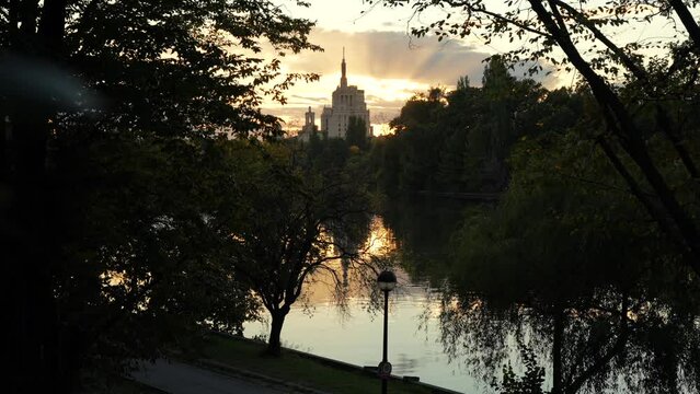 Autumn sunset over Free Press House (Casa Presei Libere in Romanian language) and Herastrau Park lake from Bucharest. Travel to Romania, amazing landscape in the heart of Bucharest.