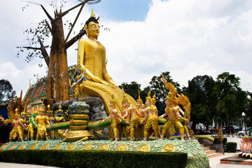 Golden big buddha image statue of Wat Maniwong for thai people travel visit tunnel cave and respect...