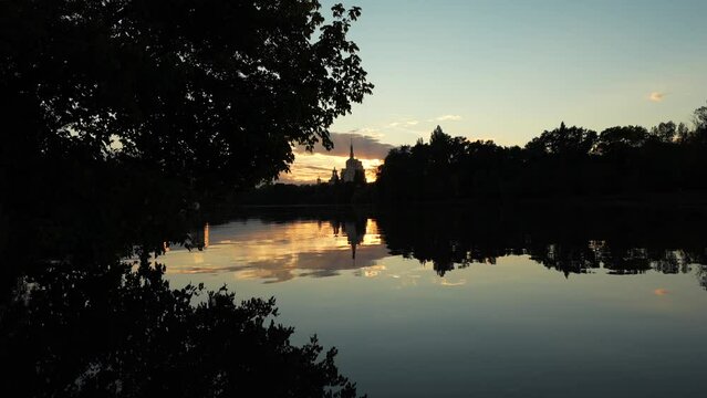 Autumn sunset over Free Press House (Casa Presei Libere in Romanian language) and Herastrau Park lake from Bucharest. Travel to Romania, amazing landscape in the heart of Bucharest.