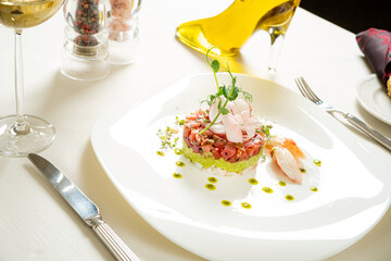 salmon tartare on the white plate