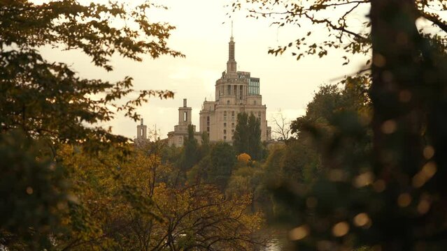 Autumn sunset over Free Press House (Casa Presei Libere in Romanian language) and Herastrau Park lake from Bucharest. Travel to Romania, amazing landscape in the heart of Bucharest, 2022.