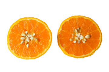Isolated orange, cut into 2 halves, showing the flesh and seeds inside. Soft and selective focus.         