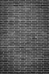 Portrait background of black and white brick wall There is a lot of texture detail and bricks.