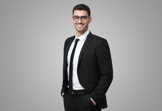 Business man in glasses looking at camera, showing confidence and providing stability for employees