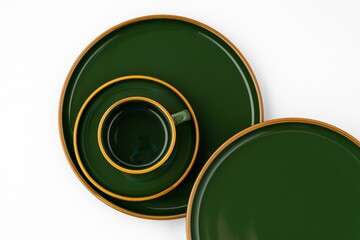 Set of dark green ceramic tableware with orange outlines