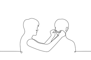 man seals his mouth with tape to another man - one line drawing vector. concept of making someone shut up, disenfranchising