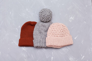 Knitted surface of woolen things as a background. Close-up of soft fabric red color knitted patterns texture. Warm winter clothing. Background textile surface with copy space for text