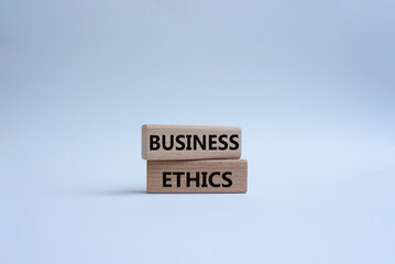 Business ethics symbol. Concept word Business ethics on wooden blocks. Beautiful white background. Business and Business ethics concept. Copy space