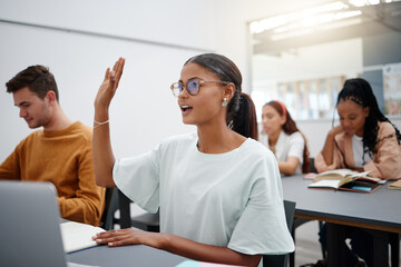 Education through questions by students at university with diversity during lecture. Young woman in classroom, asking with hand up while classmate listen on. Motivation through discussion.