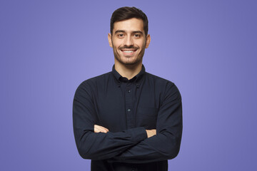 Smiling attractive business man in shirt isolated on purple background