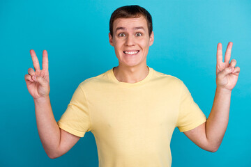 Close up photo amazing man show v-sign say hi wearing casual outfit isolated bright yellow background