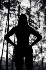Silhouette of a Girl with a beautiful body in the Forest