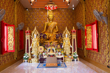Ancient golden buddha statue in antique ubosot for thai people travelers travel visit and respect...