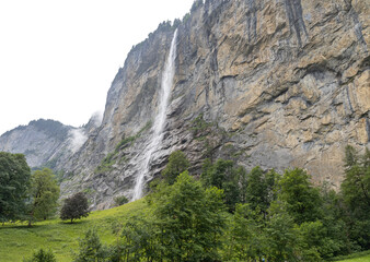 The Staubbach waterfall in Lauterbrunnen, in Bernese Oberland, Switzerland. The Staubbach waterfall with its drop of almost 300 meters is the third highest waterfall in Switzerland.
