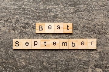 best september word written on wood block. best september text on table, concept