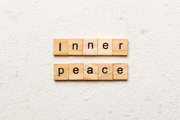 inner peace word written on wood block. inner peace text on table, concept