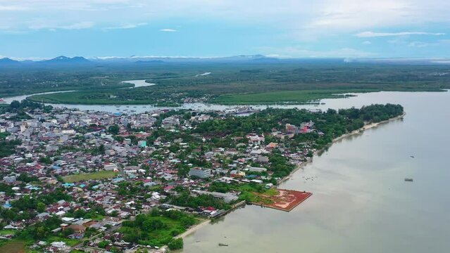 aerial landscape of Tanjung Pandan town cityscape coastline in Belitung Indonesia on cloudy day
