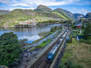 Train Bergen - Oslo in Stanghelle, Vaksdal municipality, Norway. - obrazy, fototapety, plakaty