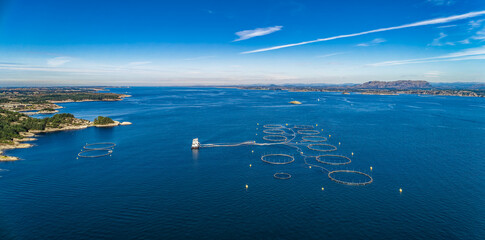 Salmon fish farm in fjord near Bergen, Norway