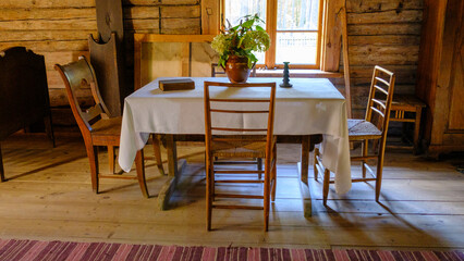 very old living room interior. minimal furniture, table, chairs