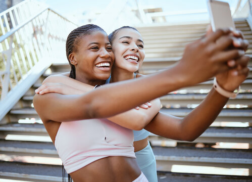 Exercise, friends and selfie on a phone with happy, relax women bonding and laughing during a workout in a city. social media, content creator and girls posing for online livestream on blog after run