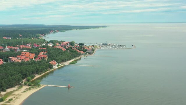 Nida town, Lithuania footage from drone, Nida little seaside town located beside russian border on curonian spit is a luxury seaside town