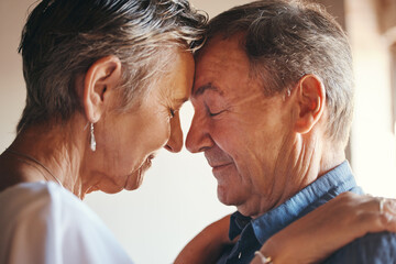 Love, support and elderly couple hug, commitment and understanding in their home together. Wellness, intimate and romantic seniors enjoy soulmate connection while bonding with affection and romance - Powered by Adobe