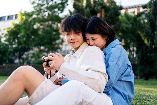 Happy Couple Using Camera