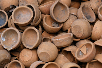 diya or clay lamp at market during Diwali festival in India.