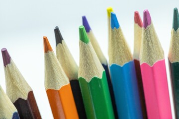Closeup of colorful pencils on a white background