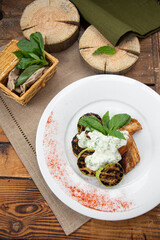 Grilled zucchini slices with sauce