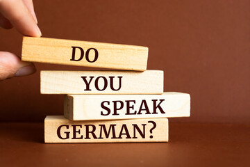 Wooden blocks with words 'Do you Speak German?'.