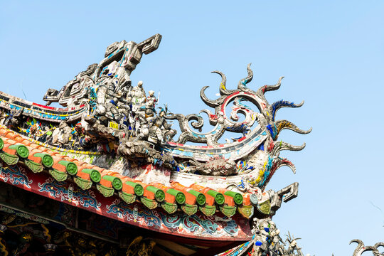 Close-up of decorative art on the rooftop of Wanhua Longshan Temple in Taipei, Taiwan.