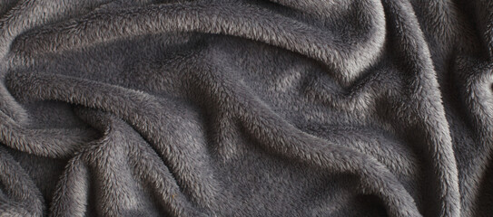 Gray wrinkled plush fabric background texture, soft material pattern. banner.