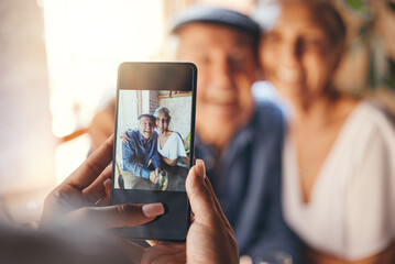Pov, phone and woman taking picture of old couple at restaurant. Love, smile and elderly, romantic and retired couple hug with person taking photo for happy memories, 5g mobile or social media post.