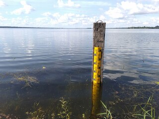 Scale measures the water level in the dam.