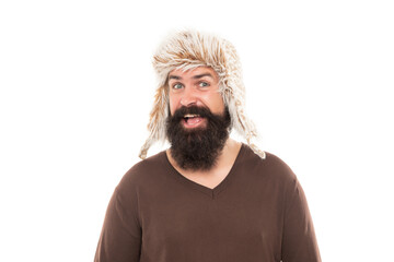 smiling bearded man portrait. mature man with beard in earflap hat. beard hair care.