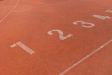 position runner athlete start point row of number in running track sports stadium. business...