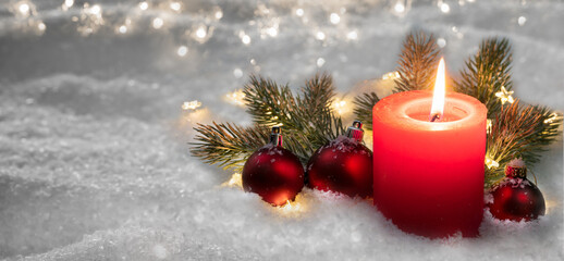 beautiful classical christmas decoration background with shiny red candlelight, balls and fir tree...