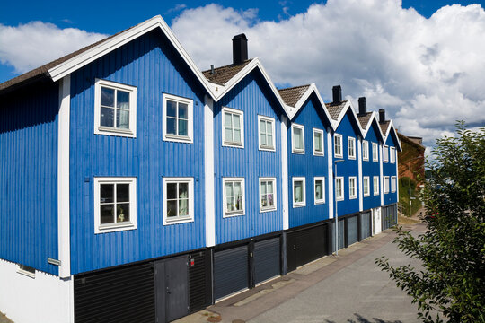 Blue wooden houses in Bjorkholmen, the oldest district of Karlskrona, Sweden
