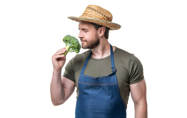 man in apron and hat smell broccoli vegetable isolated on white