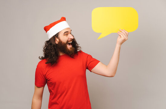 Excited man has an idea in the speech bubble he is holding for Christmas.