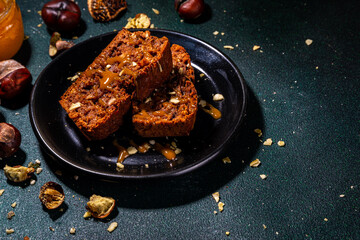 Homemade chestnut cake, sweet vegan chocolate chestnut brownie bread with honey and caramel sauce