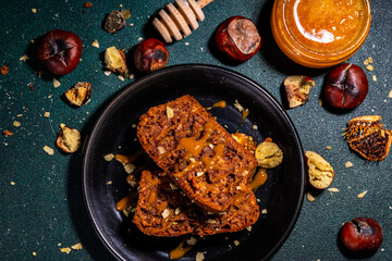 Homemade chestnut cake, sweet vegan chocolate chestnut brownie bread with honey and caramel sauce