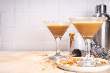 Salted caramel creamy martini drink. Sweet and salty caramel cocktail, with toffee candies, copy...