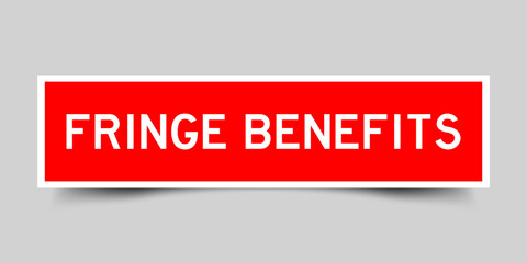 Sticker label with word fringe benefit in red color on gray background