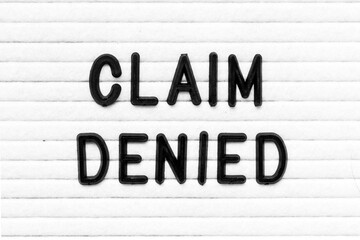 Black color letter in word claim denied on white felt board background