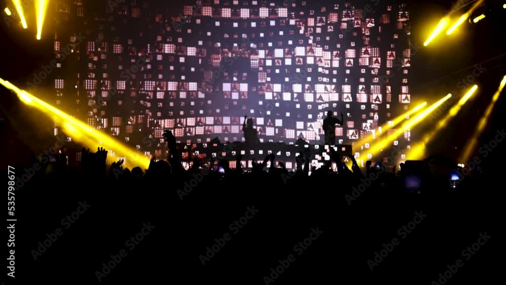 Poster laser colorful neon light rays flash and glow in seamless loop animation at concert music stage