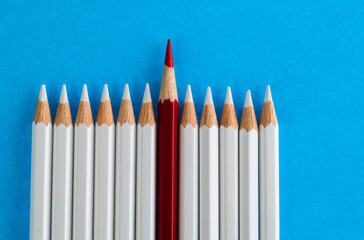 Red pencil standing out from the crowd